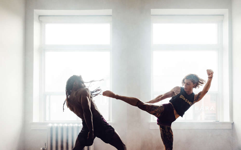 Man and woman exercising martial arts